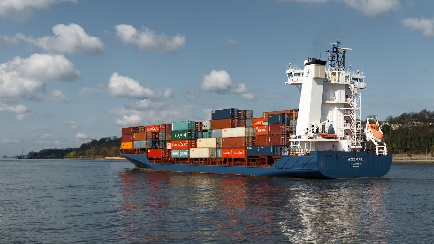 A large ship transiting a narrow channel